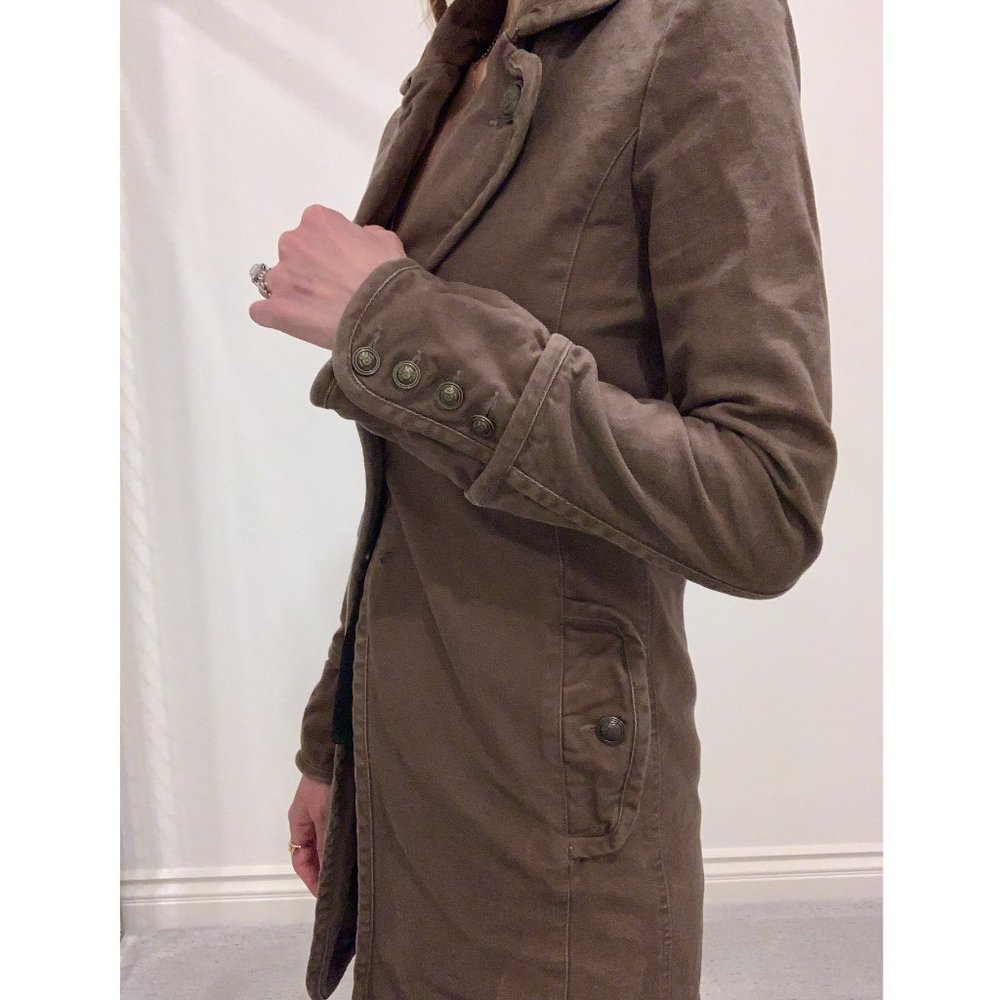 Brown structured trench coat.